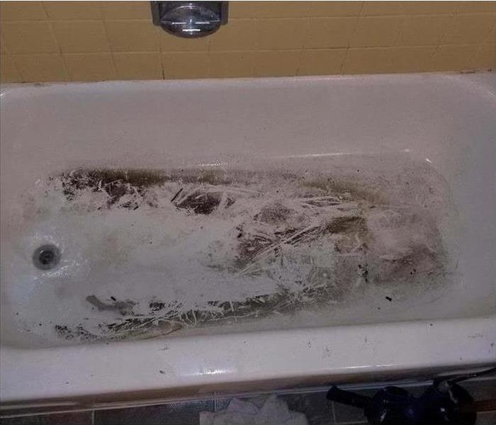 soot covered bathtub