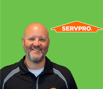 man in front of servpro tools