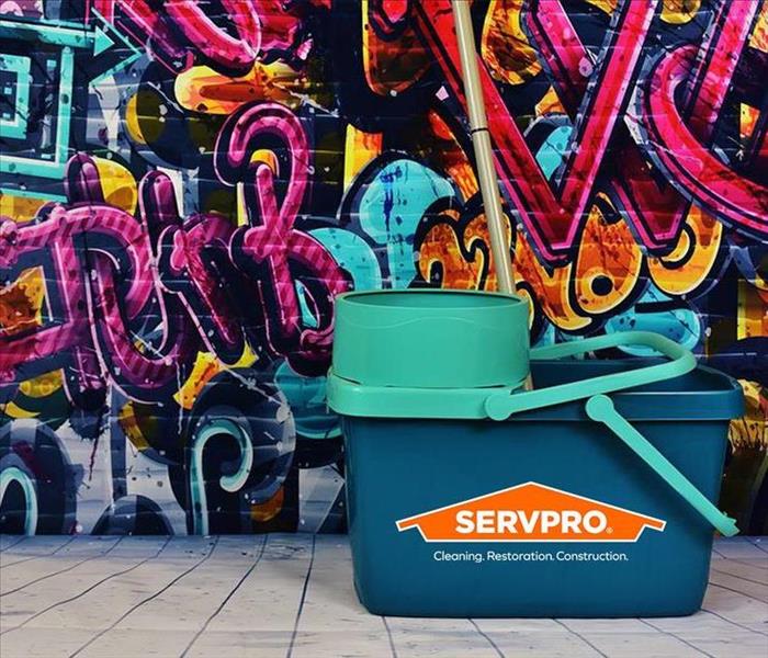 graffiti wall with cleaning bucket